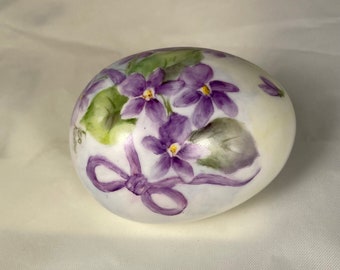 Violets on porcelain Easter egg