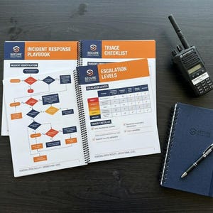 May include: A desk scene featuring a spiral-bound "Incident Response Playbook" and "Triage Checklist" with diagrams and tables. A black walkie-talkie, a blue notebook, and a pen are also present. The notebook displays the "Secure Solutions" logo.