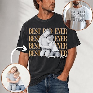 May include: Black t-shirt with the text "BEST DAD EVER" in gold lettering. A photo of two children hugging is centered on the shirt. The names "James & Sofia" are printed below the photo.