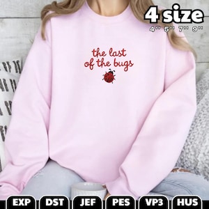 May include: A light pink sweatshirt with the text "the last of the bugs" in red script, along with a ladybug graphic. The sweatshirt has a crew neck and long sleeves. The sizes available are 4", 5", 7", and 9".