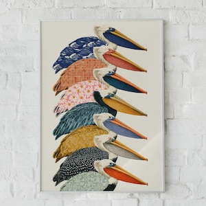 May include: A vertical art print featuring a stack of nine pelicans, each with a unique patterned body. The patterns include blue waves, orange grid, pink daisies, solid blue, yellow, grey, black with white dots, and green floral designs.