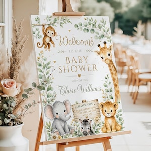 Puede incluir: Un letrero de bienvenida rectangular blanco para baby shower sobre un caballete de madera con ilustraciones en acuarela de un mono, jirafa, elefante, cebra y cachorro de león rodeados de follaje verde. El texto dice Welcome to the baby shower honoring Claire Williams.