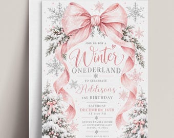 May include: A rectangular invitation card featuring a large pink bow at the top, pine branches, and snowflakes. The text reads: Join us for a Winter Onederland to celebrate Addisons 1st Birthday, Saturday December 16th at 1:00 PM.