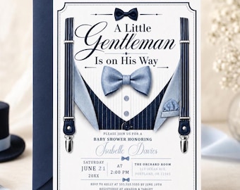 May include: A baby shower invitation card featuring a navy blue pinstripe vest graphic with a light blue bow tie, suspenders, and the text A Little Gentleman Is on His Way. The card includes details for Isabelle Davies on June 21 at 2:00 PM.