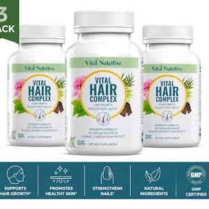May include: Three bottles of Vital Hair Complex dietary supplement. Each white bottle has a green label with the product name, floral and leaf graphics, and the text "Regrowth Formula". The bottom banner states "Supports Hair Growth".