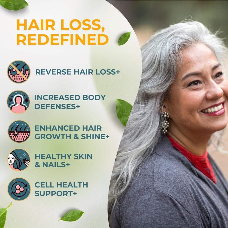 May include: Image features a smiling woman with gray hair, alongside text that reads "HAIR LOSS, REDEFINED." The image highlights benefits like reversing hair loss, increased body defenses, enhanced hair growth, healthy skin & nails, and cell health support.