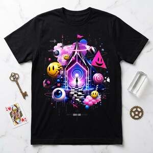 May include: A black t-shirt featuring a vibrant graphic print of a central neon-lit structure with a silhouette figure, surrounded by floating elements including yellow smiley faces, a large blue eye, pink clouds, and a checkered floor pattern.