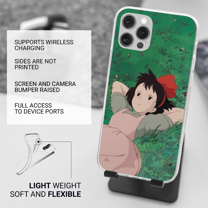May include: A clear phone case featuring a cartoon illustration of a girl with a red bow lying in grass. The case has a green background and a raised bumper for the screen and camera. The text on the left says "SUPPORTS WIRELESS CHARGING" and "LIGHT WEIGHT SOFT AND FLEXIBLE."