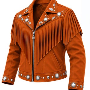 May include: A burnt orange jacket featuring long fringe detailing across the chest and back. The garment is adorned with silver-toned metal studs and leaf-shaped embellishments along the lapels, cuffs, and hem, finished with a central zipper.