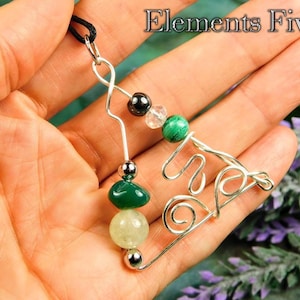 May include: A silver wire-wrapped pendant featuring the word "Five" with green, white, and black gemstone beads.