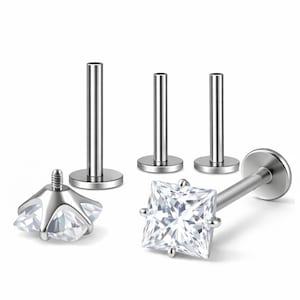 May include: A set of silver-toned labret body jewelry pieces featuring flat back posts and one square-cut clear gemstone top. The set includes three separate flat back posts and one detached square gemstone top with a threaded screw post.