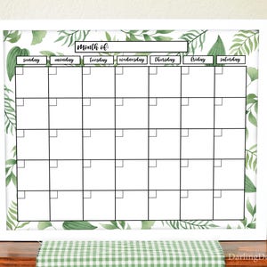 May include: White framed printable calendar with a green leafy design. The calendar has a blank space for the month and days of the week labelled Sunday through Saturday.