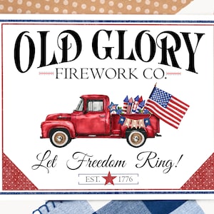 May include: A white sign with a red, white, and blue border. The sign says "Old Glory Firework Co." and features a red pickup truck with fireworks in the back. The truck is driving on a white road. The sign also says "Let Freedom Ring!" and "Est. 1776".