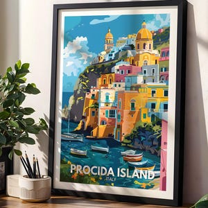 May include: A framed travel poster print featuring a colourful illustration of Procida Island, Italy, with stacked buildings in shades of yellow, pink, and blue overlooking a harbour with small boats under a bright blue sky with the text PROCIDA ISLAND ITALY.