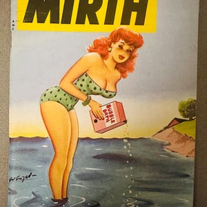May include: Vintage magazine cover titled "Mirth" with a pin-up girl in a green polka dot swimsuit. The cover includes the text "July 1954" and "25¢". The illustration shows the woman in water holding a box labeled "Bubble Bath".