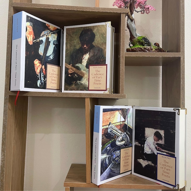 May include: A wooden bookshelf displays several books titled "The Cadence of Part-Time Poets." The book covers feature vintage-style illustrations of musicians playing instruments. The books have white spines with blue accents and gold corner protectors.