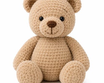 May include: A handmade, tan crochet teddy bear with a smiling face, small black eyes, and a brown nose. The bear has rounded ears, arms, and legs, and is sitting upright. The soft toy is made of a textured yarn.