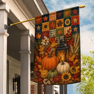 May include: A rectangular garden flag featuring a patchwork design of autumn leaves, sunflowers, and stars. The lower section displays a black lantern, orange, white, and green pumpkins, wheat stalks, cotton bolls, and vibrant fall flowers.