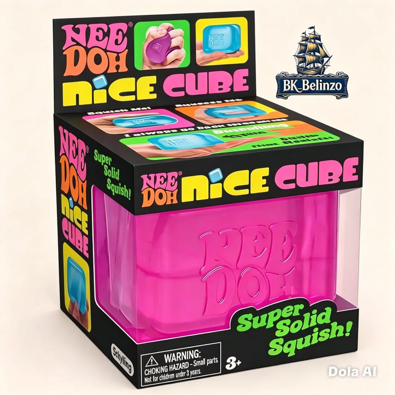 May include: A Nee Doh Nice Cube squishy toy in a black retail display box. The box features bright pink, yellow, and green text with the words Nee Doh Nice Cube and Super Solid Squish. The toy inside is a solid pink cube with the logo embossed on it.