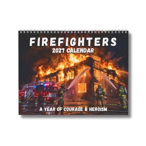 May include: A 2021 wall calendar titled FIREFIGHTERS 2021 CALENDAR A YEAR OF COURAGE & HEROISM. The cover features a night scene of a building engulfed in bright orange flames with firefighters in protective gear spraying water from hoses.