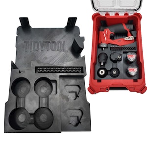 May include: A black plastic tool organizer insert with the text TIDYTOOL embossed on the surface, featuring molded compartments for a drill, batteries, and bits, shown alongside a red hard-shell carrying case containing a power tool set.