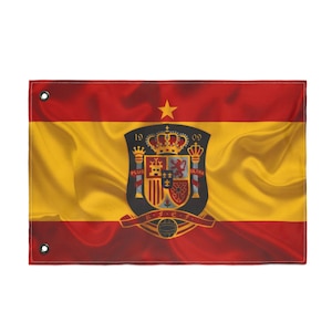 May include: A rectangular flag with the Spanish coat of arms. The flag has a horizontal tricolor design of red, yellow, and red. The coat of arms is in the center, featuring a crown, shields, and the text "R.F.E.F."
