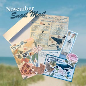 May include: A November Snail Mail stationery set featuring a letter from East Coast Mail Co., a Connecticut postcard, a lighthouse bookmark, and stickers of a squirrel, a doughnut, and a whale, all decorated with autumn leaves and food.
