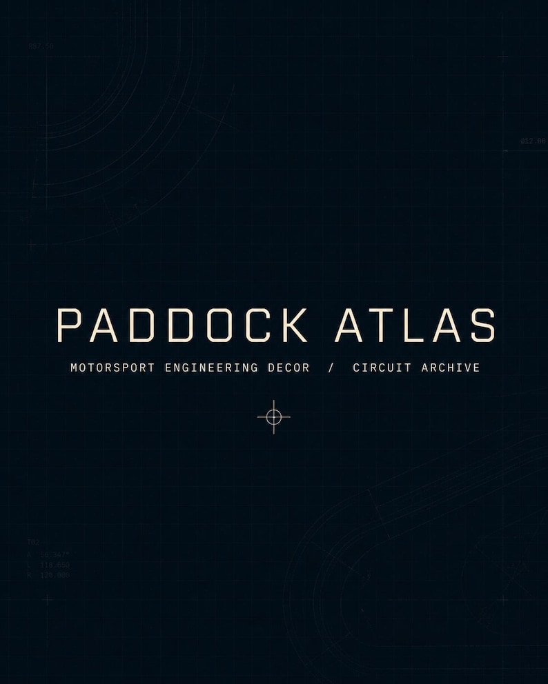 May include: Dark blue graphic design with the text "PADDOCK ATLAS" in white, with the subtext "MOTORSPORT ENGINEERING DECOR / CIRCUIT ARCHIVE". The design includes faint circular and linear grid patterns.