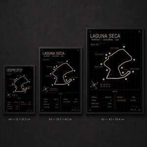 May include: Three framed black and white track maps of Laguna Seca in Monterey, California. The maps are labeled A4 (8.3 x 11.7 inches), A3 (11.7 x 16.5 inches), and A2 (16.5 x 23.4 inches). Each map includes track details.
