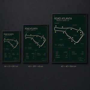 May include: Three framed prints of the Road Atlanta race track map. The prints are in A4 (8.3 x 11.7 inches), A3 (11.7 x 16.5 inches), and A2 (16.5 x 23.4 inches) sizes. Each print features a green background with white lines and text detailing track specifications.