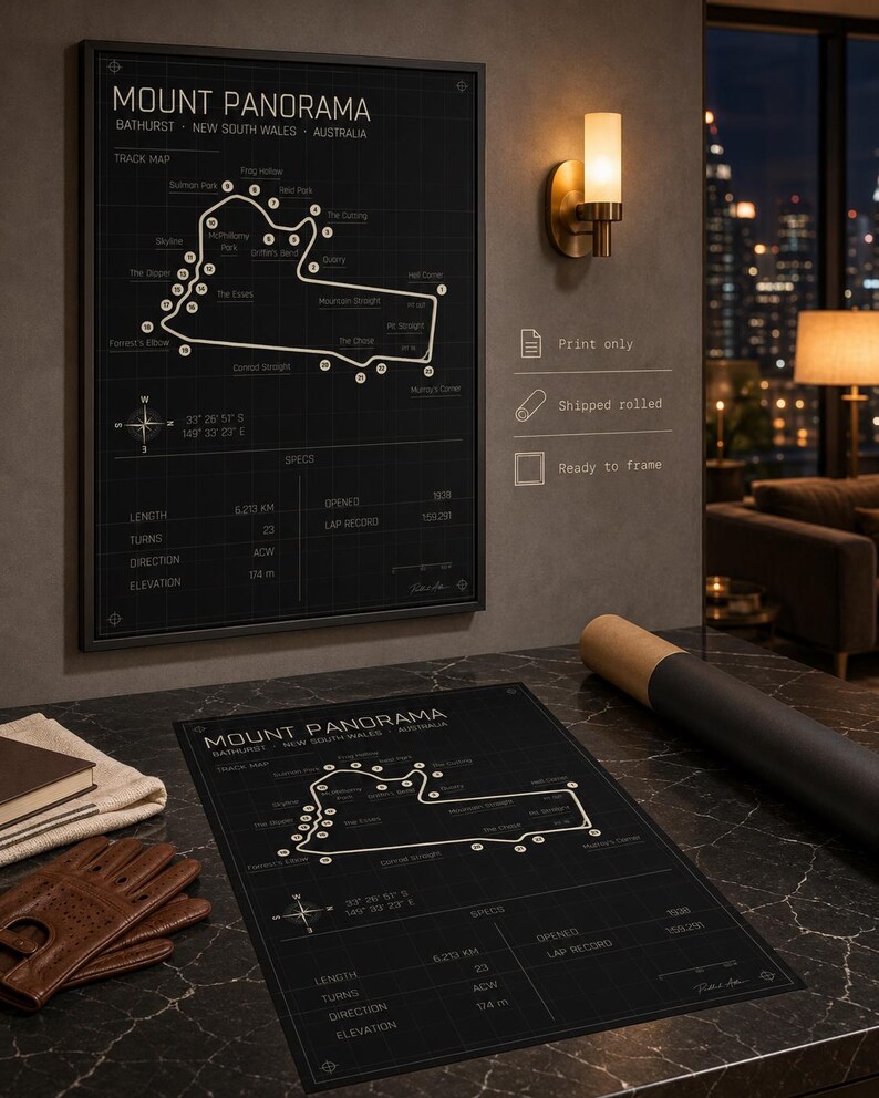May include: Black framed Mount Panorama track map print. The map includes track details, coordinates, and specifications. A second print and a rolled print are also visible. The print is ready to frame.