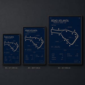 May include: Three framed prints of the Road Atlanta track map in Braselton, Georgia, USA. The prints are in varying sizes, with a dark blue background and white track layout. The largest print is 42 x 59.4 cm.