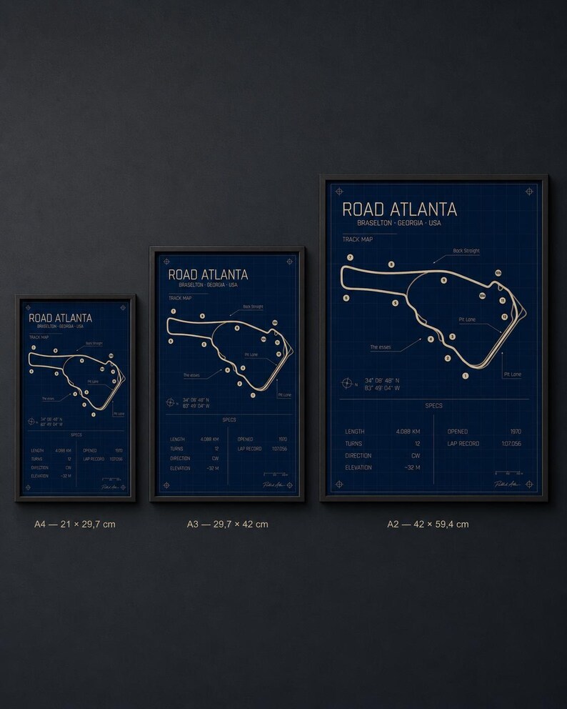 May include: Three framed prints of the Road Atlanta track map in Braselton, Georgia, USA. The prints are in varying sizes, with a dark blue background and white track layout. The largest print is 42 x 59.4 cm.