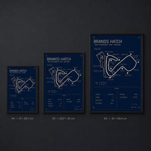 May include: Three framed blue prints of the Brands Hatch race track in West Kingsdown, Kent, England. The prints are labeled A4 (8.3 x 11.7 inches), A3 (11.7 x 16.5 inches), and A2 (16.5 x 23.4 inches). Each print features track details.