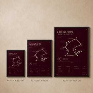 May include: Three framed prints of the Laguna Seca racetrack map in a burgundy color. The prints are labeled A4 (8.3 x 11.7 inches), A3 (11.7 x 16.5 inches), and A2 (16.5 x 23.4 inches). Each print features the track layout and specifications.