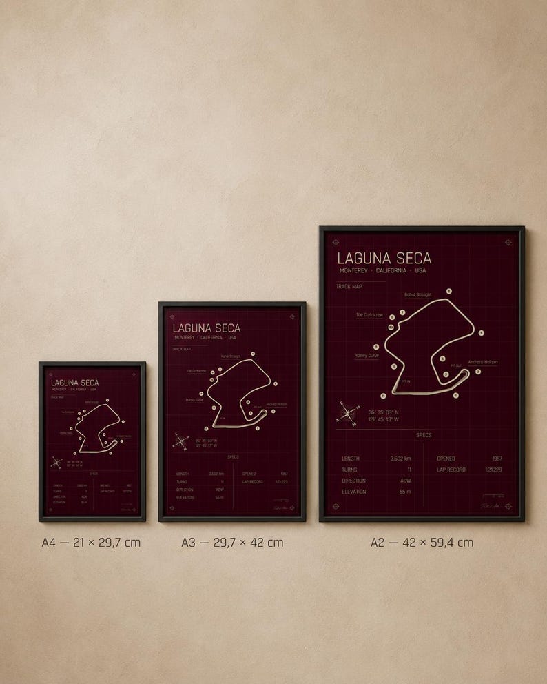 May include: Three framed prints of the Laguna Seca racetrack map in a burgundy color. The prints are labeled A4 (8.3 x 11.7 inches), A3 (11.7 x 16.5 inches), and A2 (16.5 x 23.4 inches). Each print features the track layout and specifications.