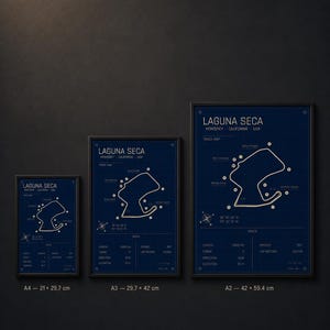 May include: Three framed prints of the Laguna Seca racetrack map in Monterey, California, USA. The prints are in black frames, with a blue background and white and gold details. Sizes include A4 (8.3 x 11.7 inches), A3 (11.7 x 16.5 inches), and A2 (16.5 x 23.4 inches).