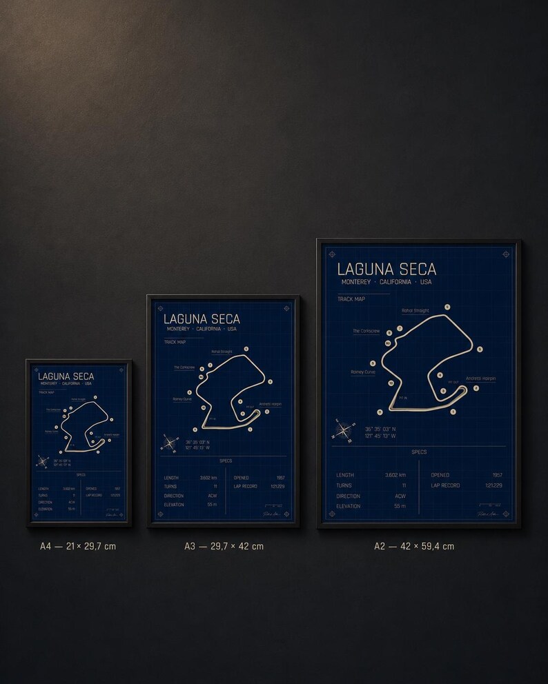 May include: Three framed prints of the Laguna Seca racetrack map in Monterey, California, USA. The prints are in black frames, with a blue background and white and gold details. Sizes include A4 (8.3 x 11.7 inches), A3 (11.7 x 16.5 inches), and A2 (16.5 x 23.4 inches).