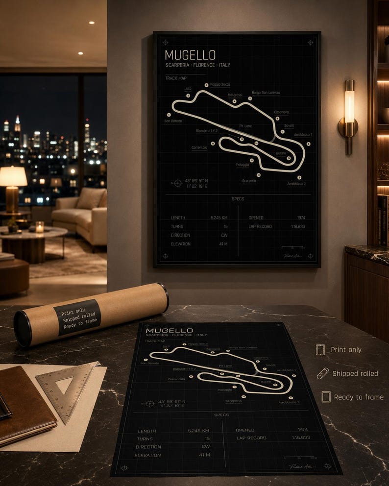 May include: Black and white Mugello race track map print. The track map is displayed on a black background with white lines and text. The print includes track specifications and is ready to frame. A rolled print is also shown.