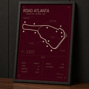 May include: Framed print of the Road Atlanta race track in Braselton, Georgia, USA. The burgundy-colored map includes track details, labeled features, and specifications such as length (4.088 km), turns (12), and elevation (-32 m).