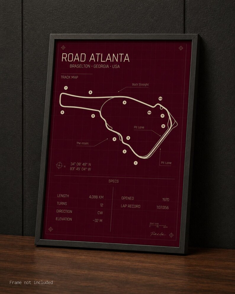 May include: Framed print of the Road Atlanta race track in Braselton, Georgia, USA. The burgundy-colored map includes track details, labeled features, and specifications such as length (4.088 km), turns (12), and elevation (-32 m).