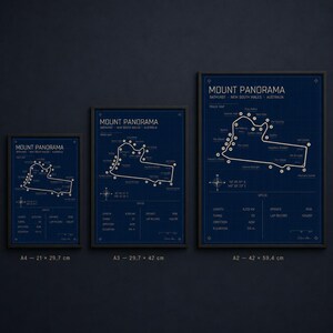 May include: Three framed Mount Panorama track maps in varying sizes. The maps are in white on a dark blue background. The smallest is 8.3 x 11.7 inches, the middle is 11.7 x 16.5 inches, and the largest is 16.5 x 23.4 inches.