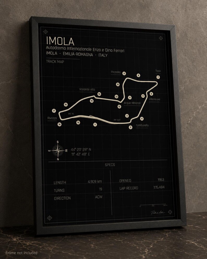 May include: Black framed print of the Imola race track map. The track map is white on a black background, with the track name and specs. The print includes the track length of 4.909 km, 19 turns, and opened in 1953.