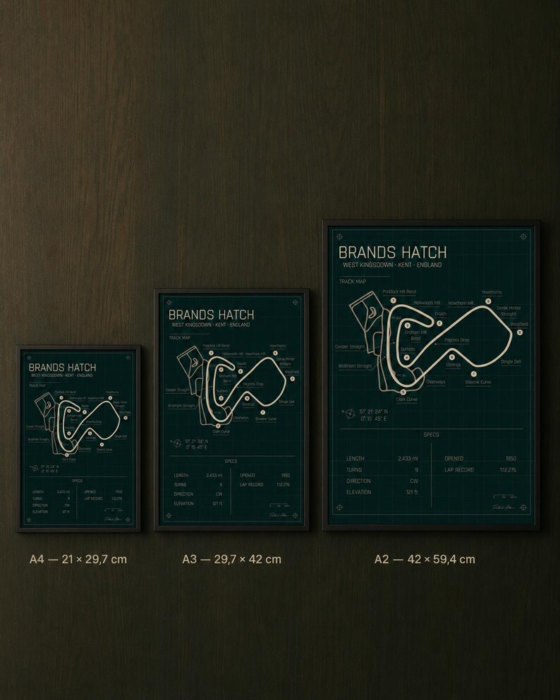 May include: Three framed prints of the Brands Hatch race track in West Kingsdown, Kent, England. The prints are in A4 (8.3 x 11.7 inches), A3 (11.7 x 16.5 inches), and A2 (16.5 x 23.4 inches) sizes, with a dark teal background and white track details.
