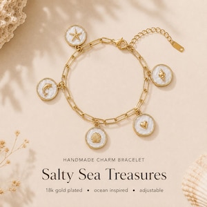 May include: Gold-plated charm bracelet featuring ocean-themed charms. The bracelet includes charms with a starfish, dolphin, seashell, heart, and conch shell designs. The text "Salty Sea Treasures" is displayed below the bracelet.