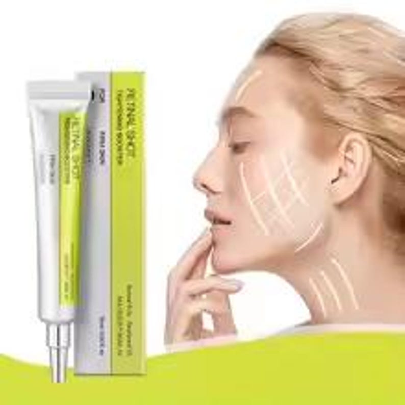 May include: A white and lime green tube of Retinal Shot wrinkle booster cream next to its matching rectangular box. The packaging features the text Retinal Shot, Firm Skin, and 15ml 0.50 fl. oz. The product is shown alongside a profile view of a face.