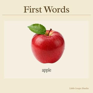 May include: A glossy red apple with a green leaf, set against a cream backdrop. The word "apple" is written beneath the fruit, and "First Words" is at the top. The image is from Little Leaps Studio.