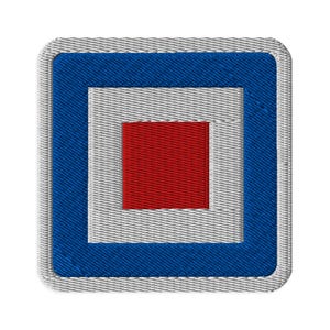 May include: A square embroidered patch featuring a maritime signal flag design. The patch has a white border, a thick blue square frame, a white inner square, and a solid red square in the center. The embroidery shows a textured thread pattern.