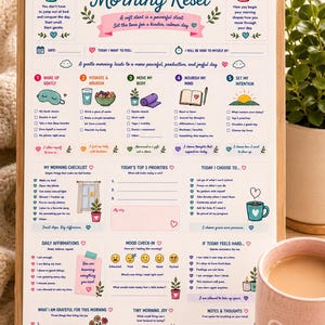May include: A wooden clipboard holding a printed Gentle Morning Reset checklist with colorful icons, text, and checkboxes. The document includes sections for daily intentions, morning routines, priorities, affirmations, and mood tracking.
