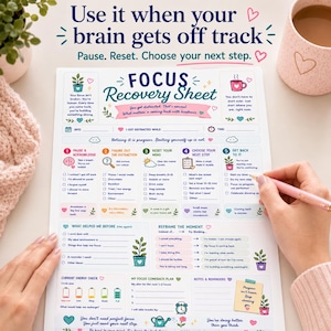 May include: A white paper Focus Recovery Sheet with colorful text and icons. The sheet includes sections for pausing, identifying distractions, resetting the mind, choosing a next step, and getting back to tasks, with a pink pen held over the paper.